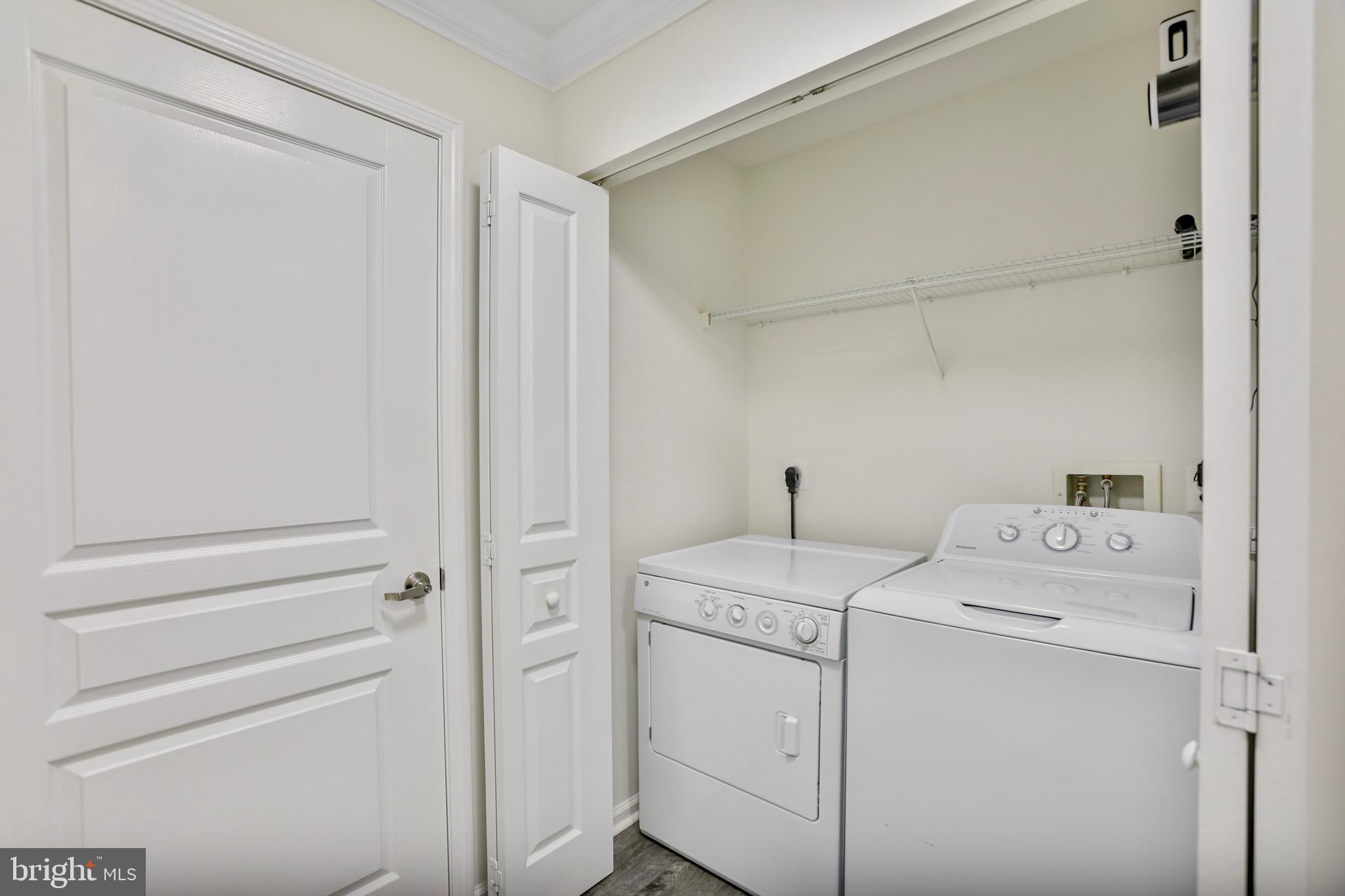 12001 Market Street, Unit T35 Reston, VA 20190 - Photo 15 of 23 a utility room with dryer and washer