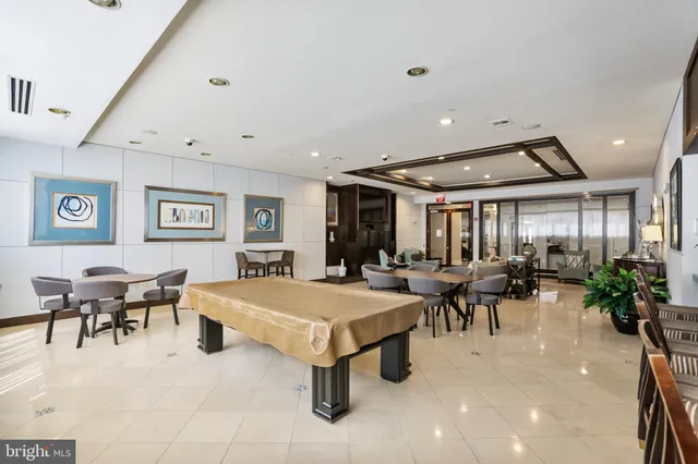 a living room with furniture and white walls