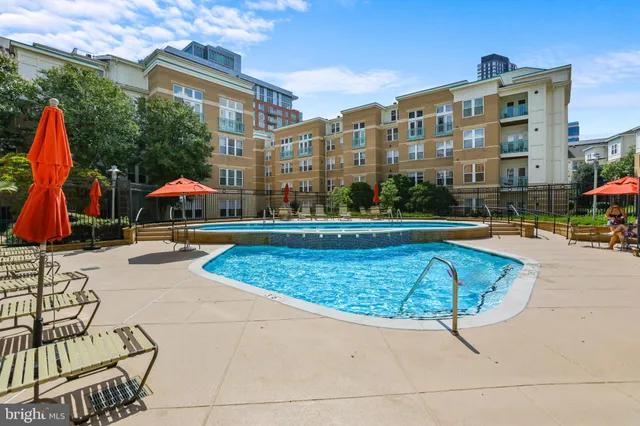 a view of building with swimming pool and porch