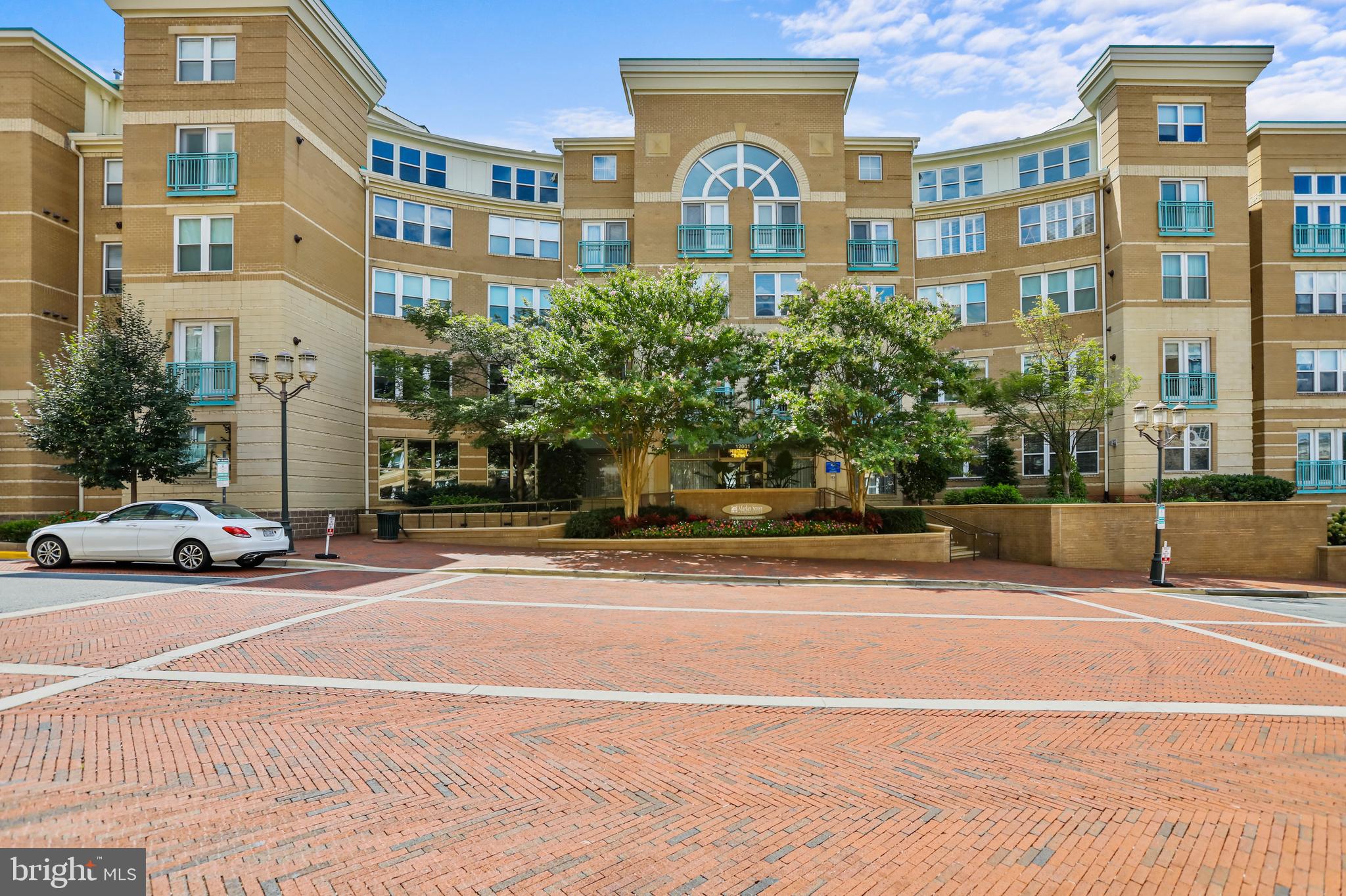 12001 Market Street, Unit T35 Reston, VA 20190 - Photo 2 of 23 a view of a city that has a lots of cars parked on the road