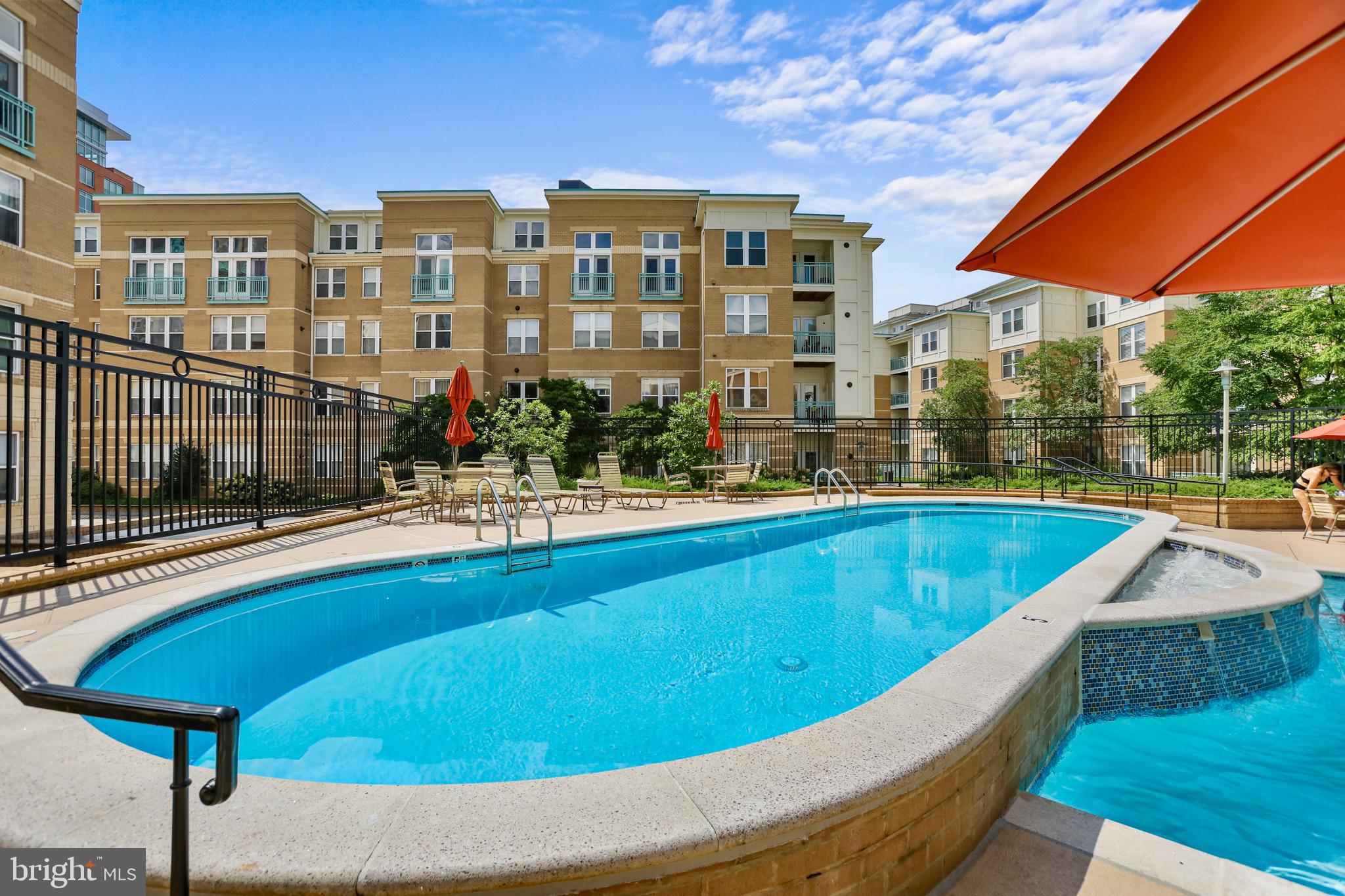 12001 Market Street, Unit T35 Reston, VA 20190 - Photo 21 of 23 a view of swimming pool with outdoor seating and city view