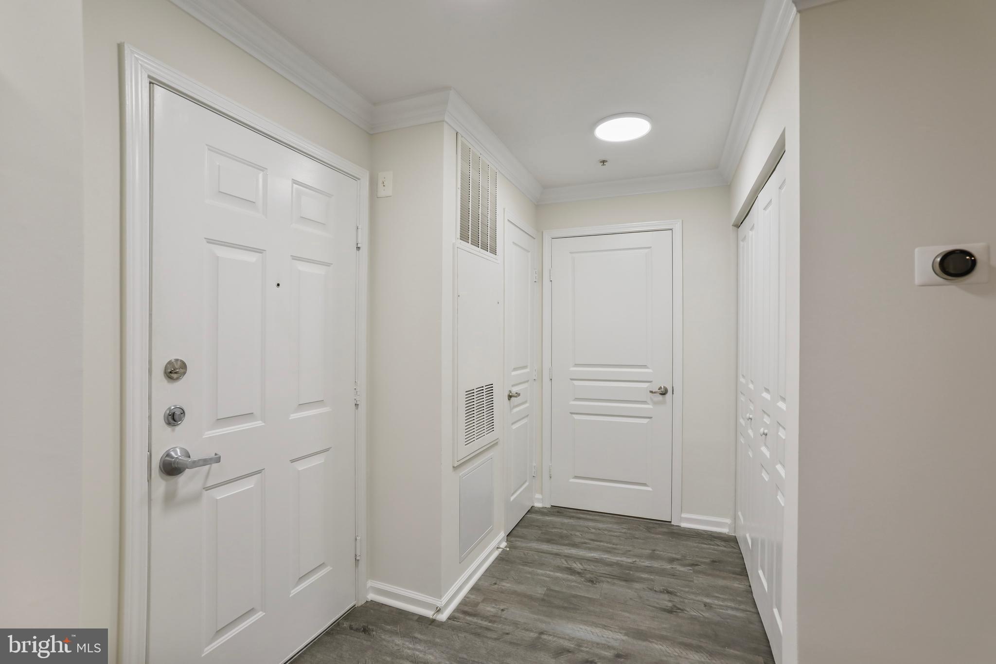 12001 Market Street, Unit T35 Reston, VA 20190 - Photo 4 of 23 a view of a bathroom with wooden floor