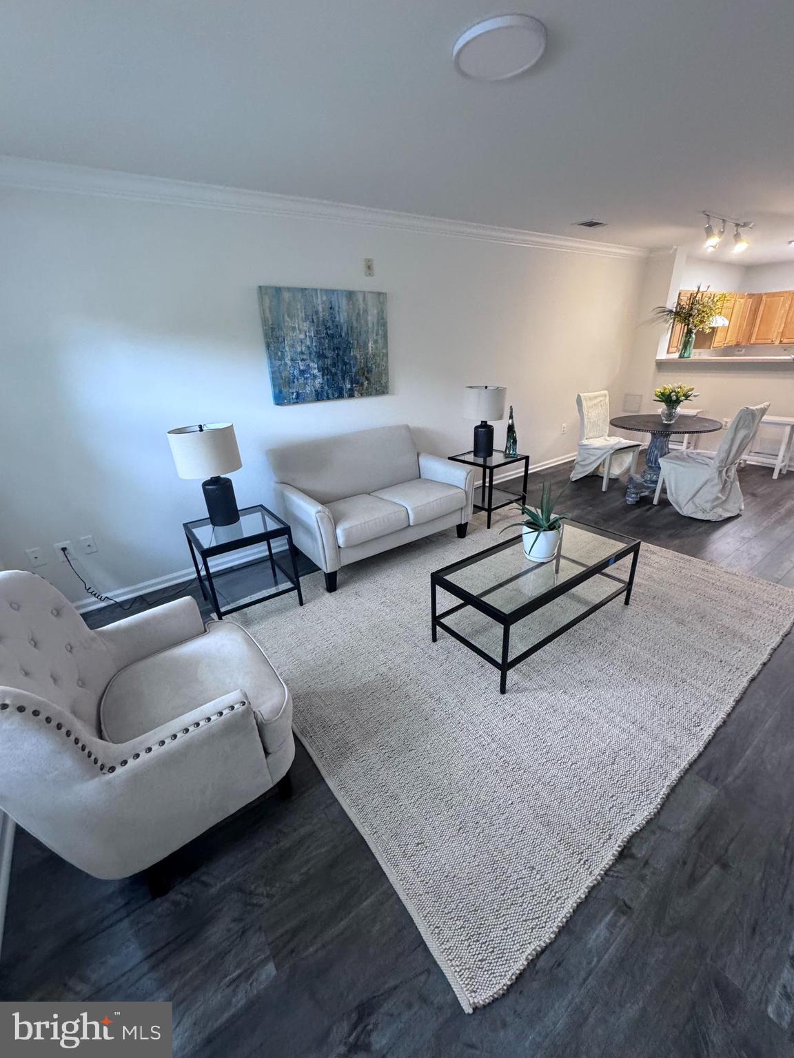 12001 Market Street, Unit T35 Reston, VA 20190 - Photo 5 of 23 a living room with furniture and a couch