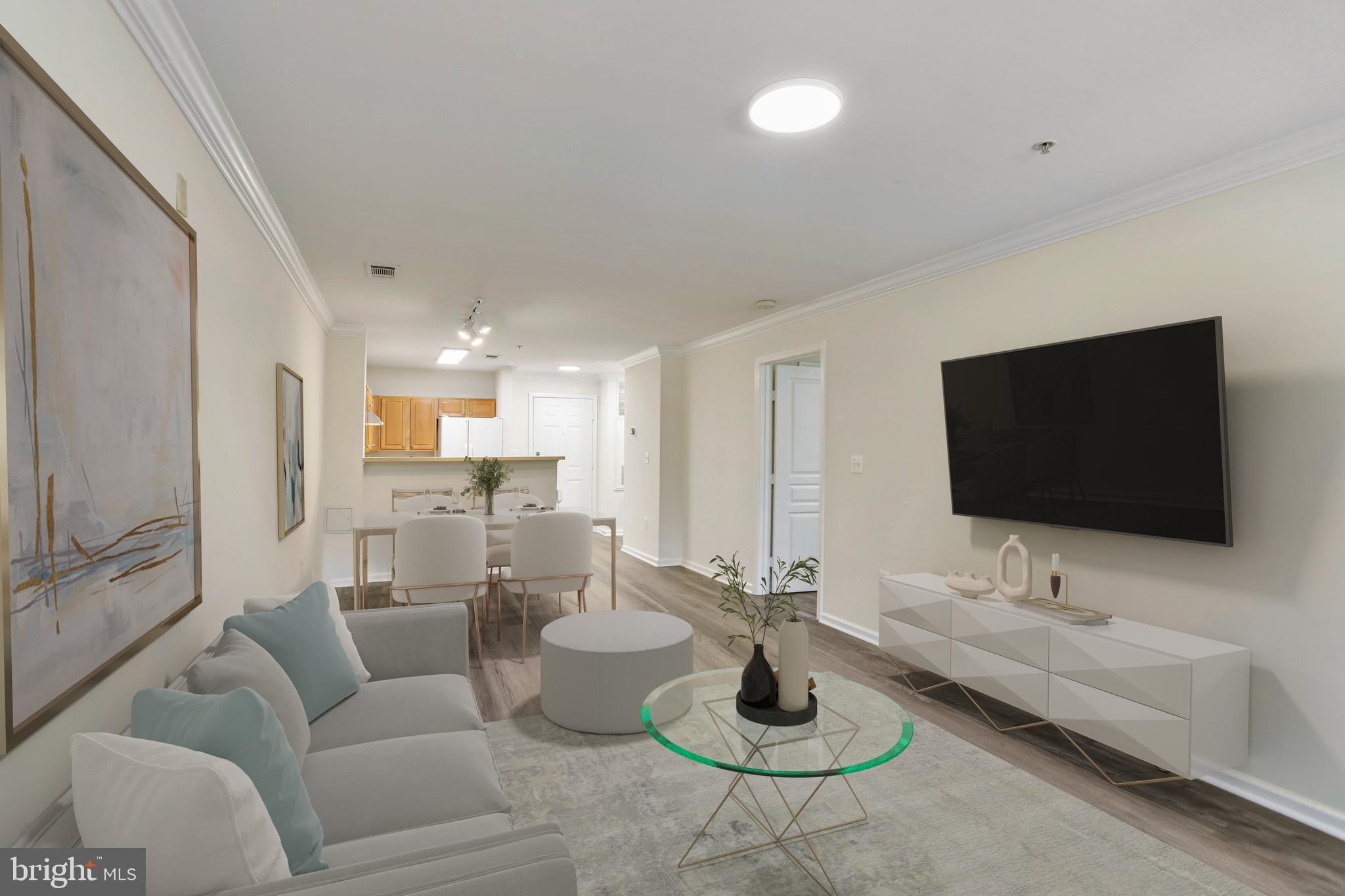 12001 Market Street, Unit T35 Reston, VA 20190 - Photo 7 of 23 a living room with furniture and a flat screen tv