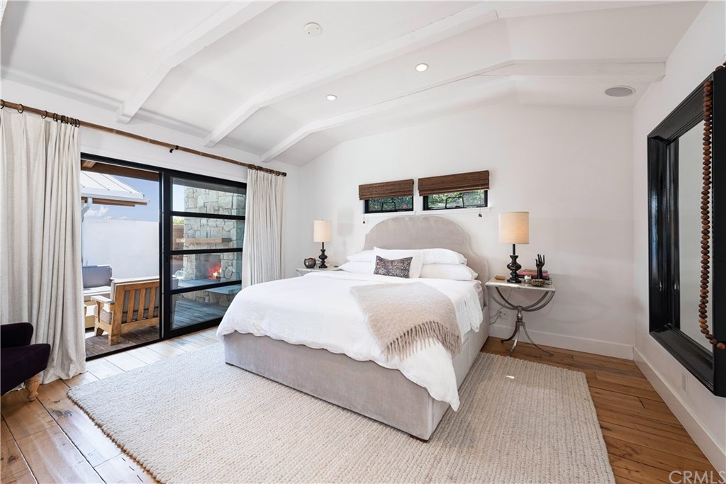 32561 Balearic Dana Point, CA 92629 - Photo 11 of 41 Beautiful Master Bedroom with sliding fleetwood doors and outside access to courtyard and fireplace.
