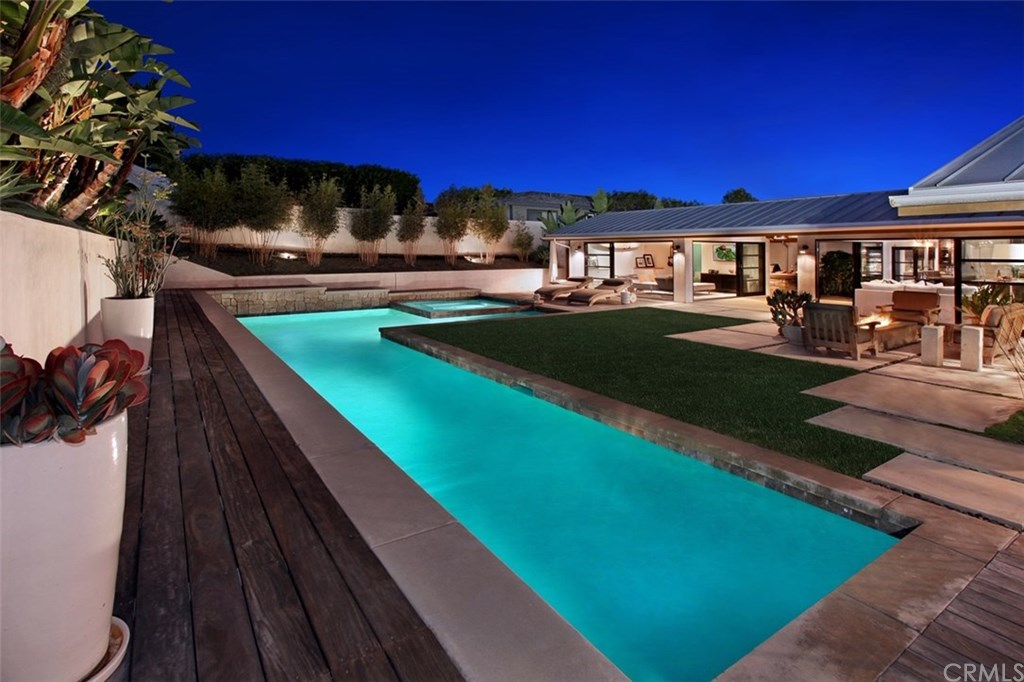 32561 Balearic Dana Point, CA 92629 - Photo 41 of 41 Nighttime view of the extra deep (10 foot) pool with Jacuzzi. This property is perfect for entertaining and enjoying year round. Ipe decks built all around the entire pool add to the beauty.