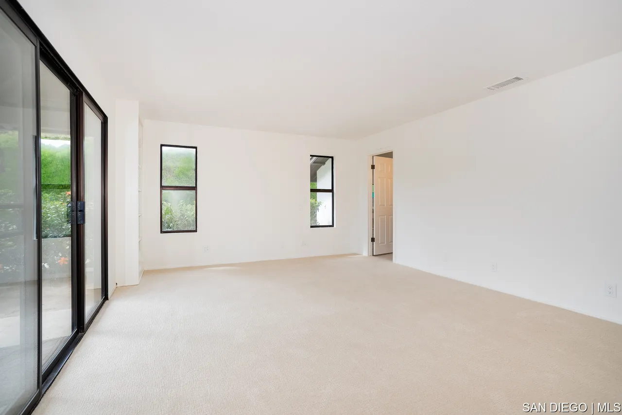627 Elm Tree Lane Fallbrook, CA 92028 - Photo 8 of 34 an empty room with windows