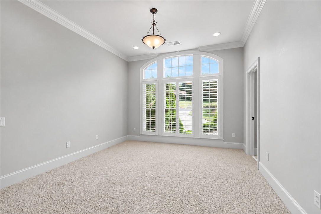 114 Willowbend Drive Anderson, SC 29621 - Photo 25 of 50 This spacious room features elegant crown molding and ample natural light through its large arched window.