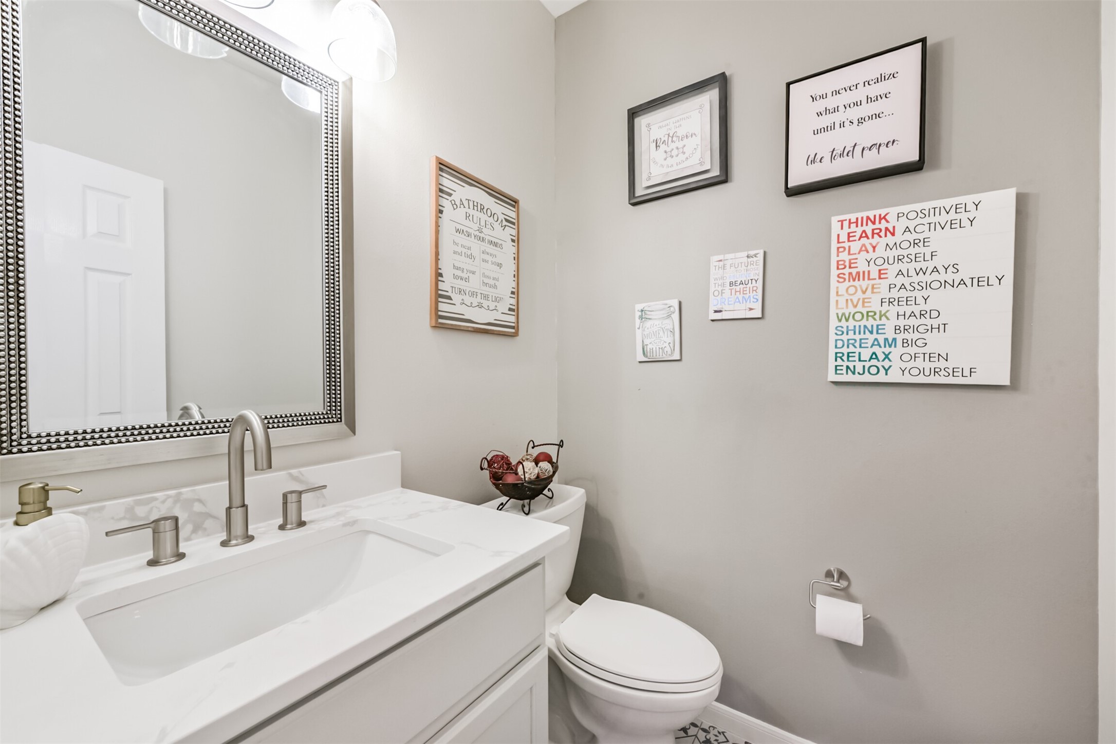 6806 Russelfield Lane Houston, TX 77049 - Photo 12 of 46 a bathroom with a sink mirror vanity and toilet