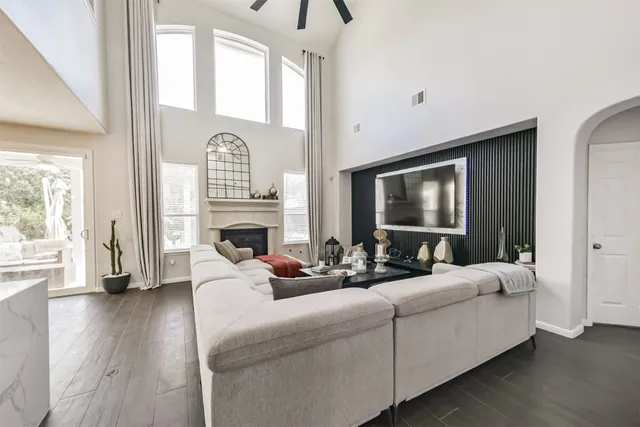 a kitchen with white cabinets and appliances