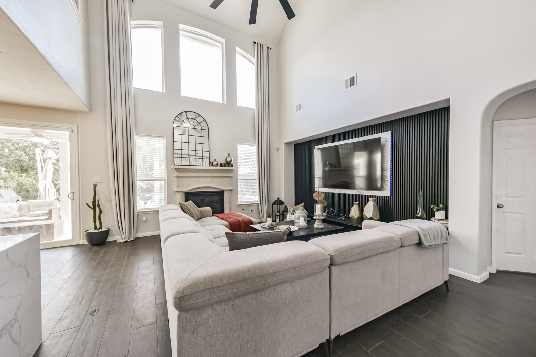 6806 Russelfield Lane Houston, TX 77049 - Photo 13 of 46 a living room with furniture fireplace and flat screen tv