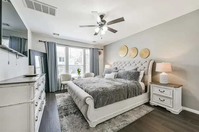 a kitchen with a stove a faucet a cabinets and a window