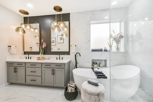 a kitchen with stainless steel appliances kitchen island granite countertop a sink a stove and a refrigerator