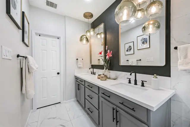 a living room with patio furniture and a large window