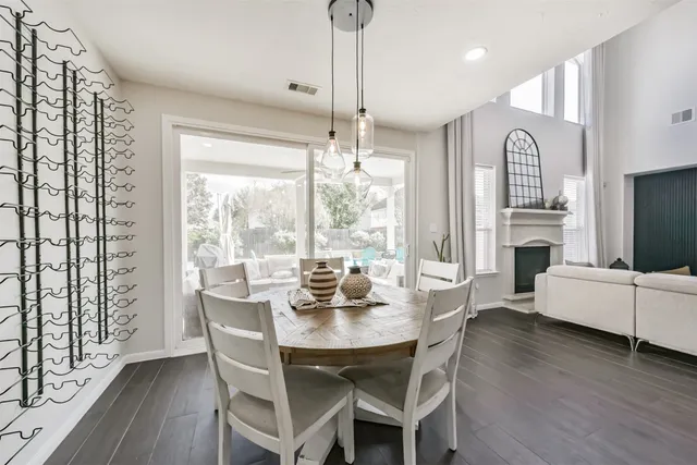 a front view of a house with swimming pool having outdoor seating