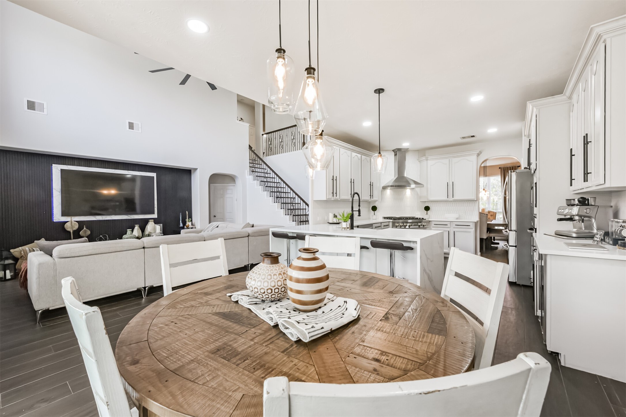 6806 Russelfield Lane Houston, TX 77049 - Photo 25 of 46 a kitchen with stainless steel appliances kitchen island granite countertop a sink a stove and a refrigerator