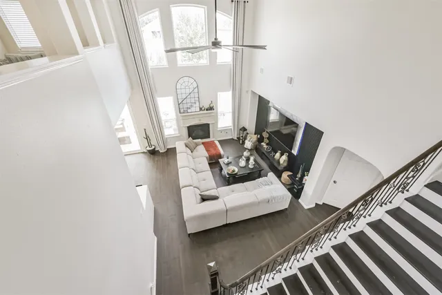 a bedroom with two beds and a chandelier