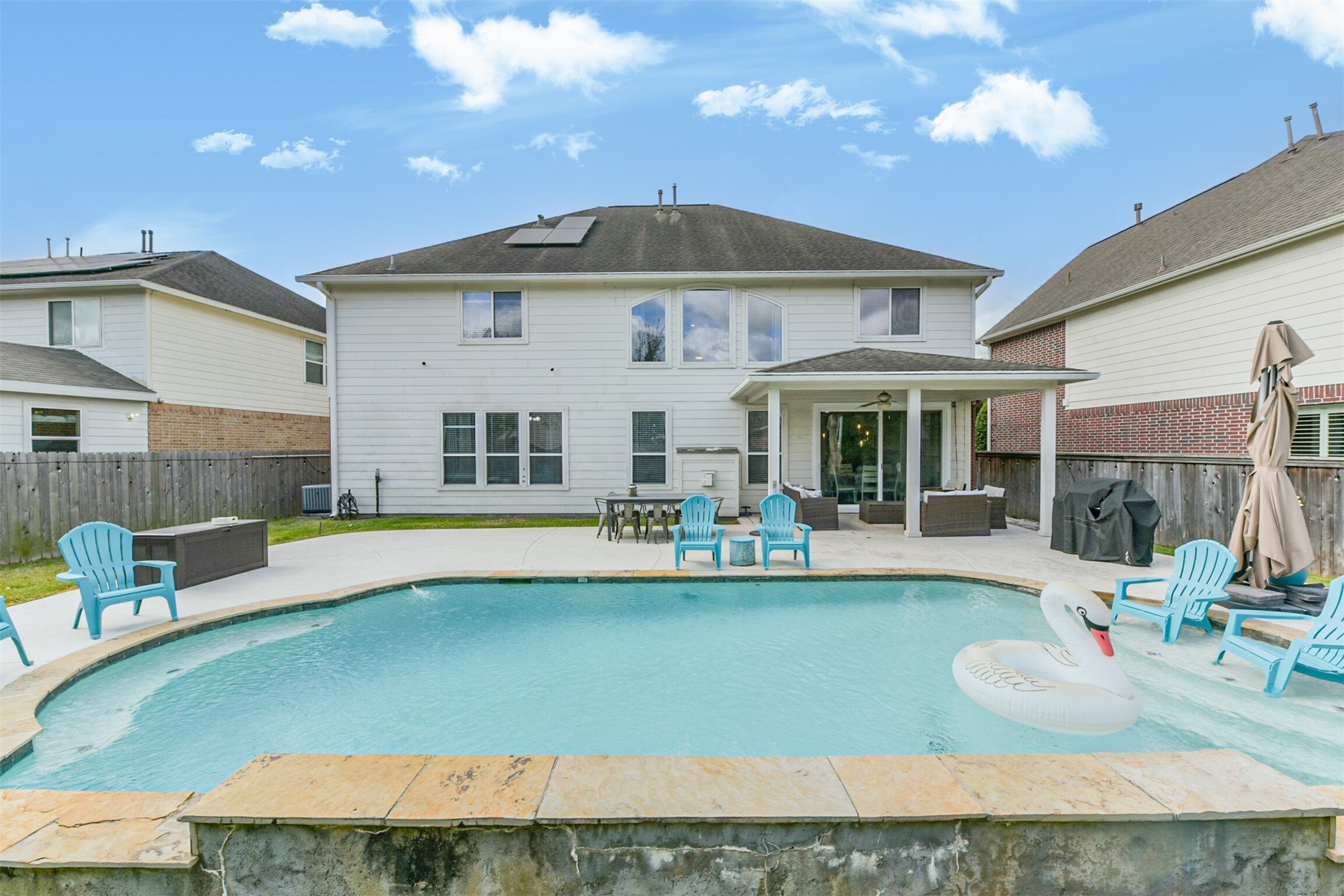 6806 Russelfield Lane Houston, TX 77049 - Photo 31 of 46 a front view of a house with swimming pool having outdoor seating