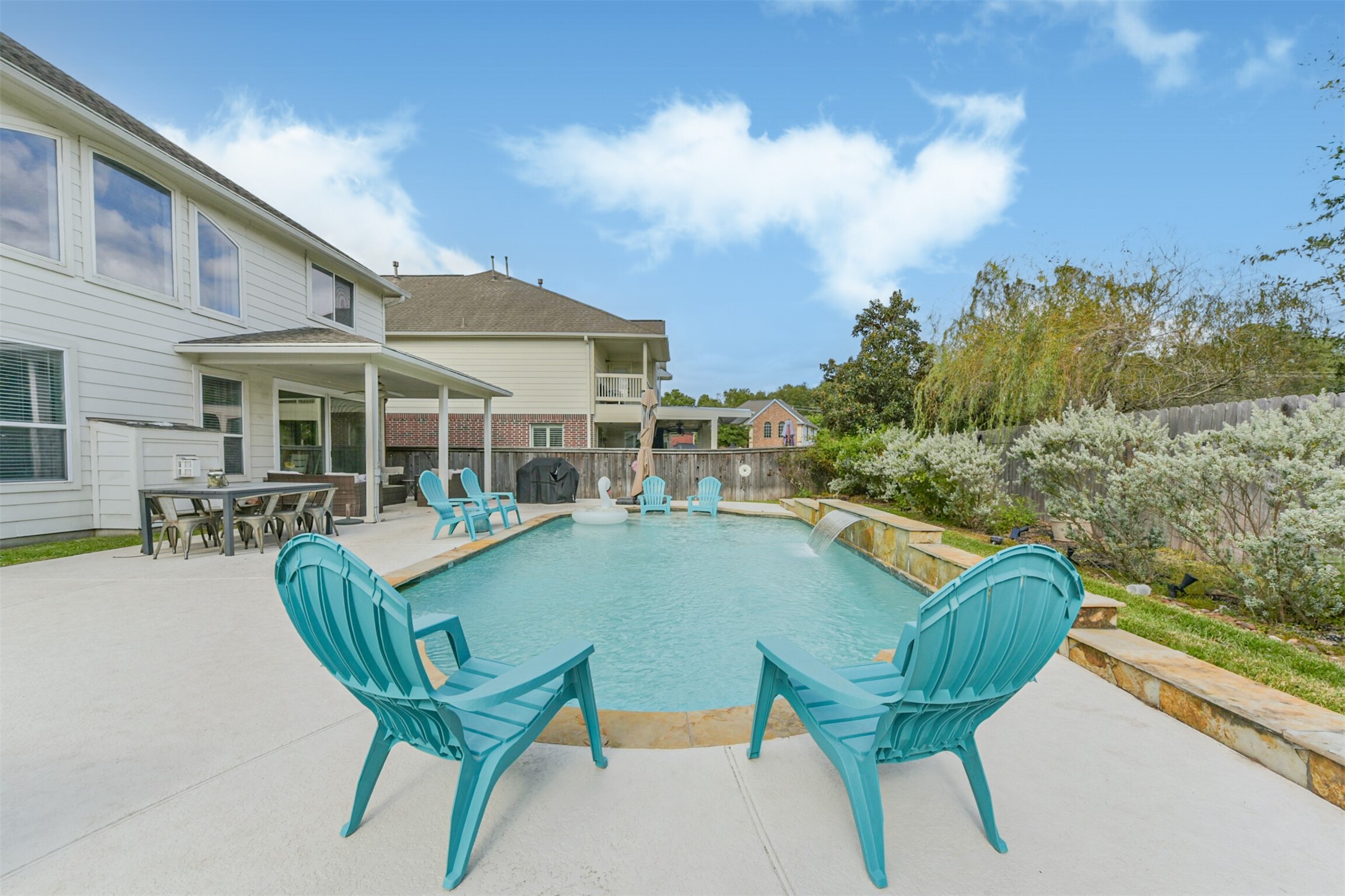 6806 Russelfield Lane Houston, TX 77049 - Photo 34 of 46 a view of a patio with table and chairs with wooden floor and fence