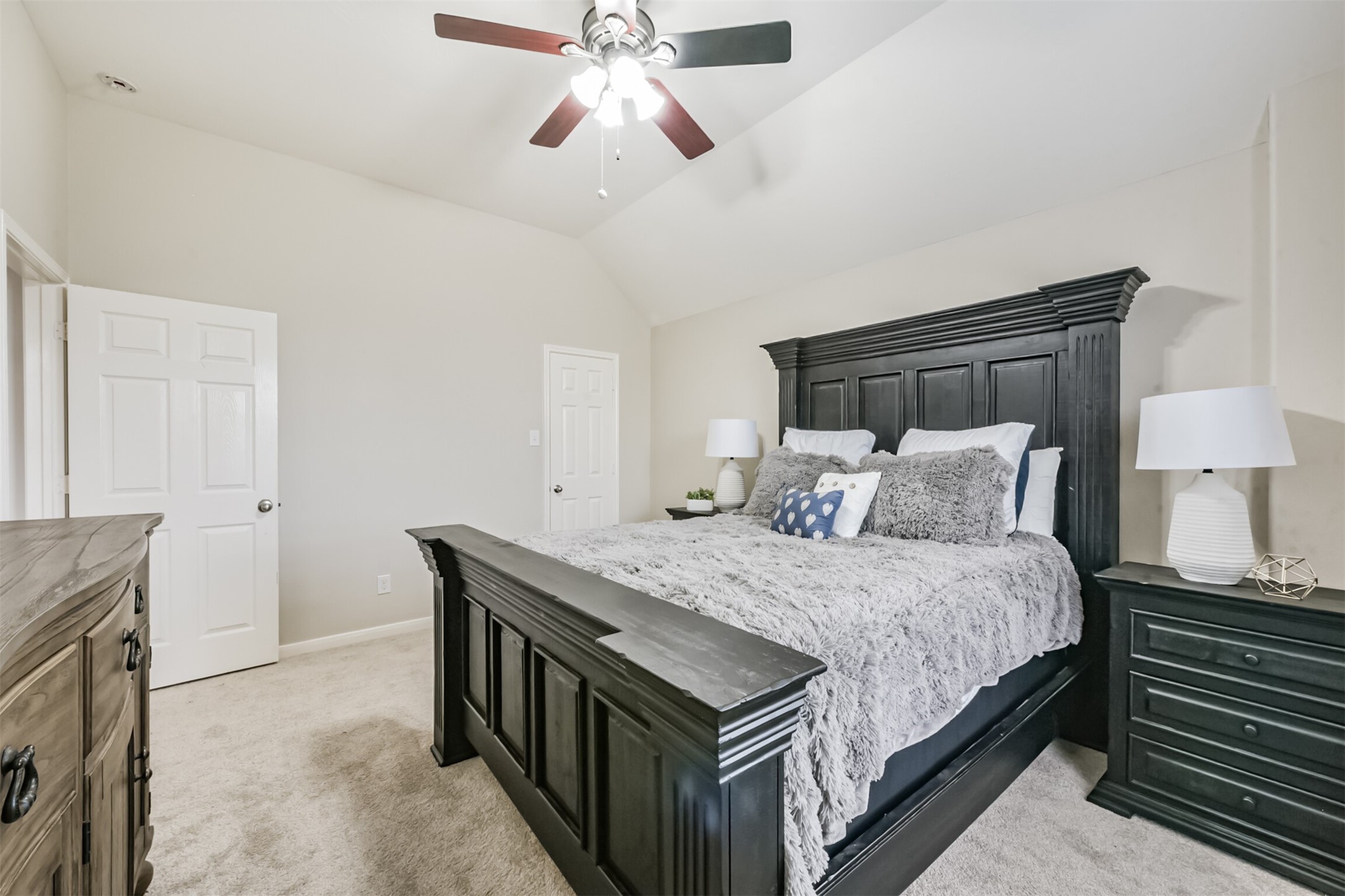 6806 Russelfield Lane Houston, TX 77049 - Photo 37 of 46 a bedroom with bed and a chandelier