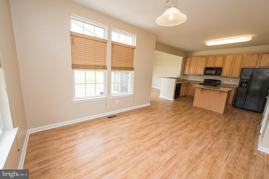 1406 Cat Tail Court Salisbury, MD 21804 - Photo 11 of 68 a view of a kitchen with a sink microwave and cabinets