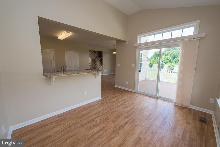 1406 Cat Tail Court Salisbury, MD 21804 - Photo 16 of 68 an empty room with wooden floor and a window