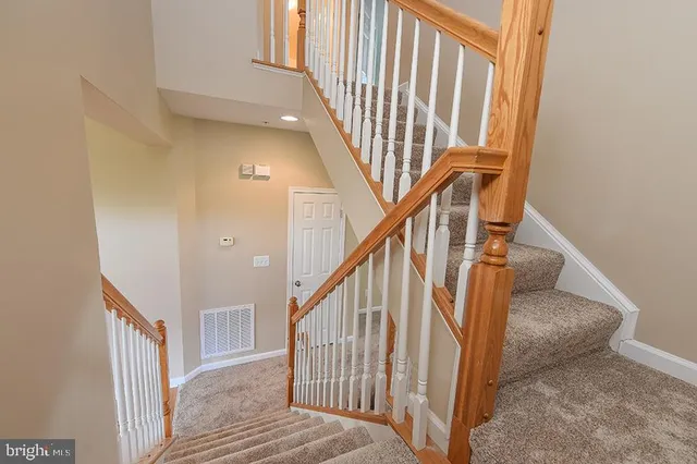 a bathroom with a toilet a sink and a mirror