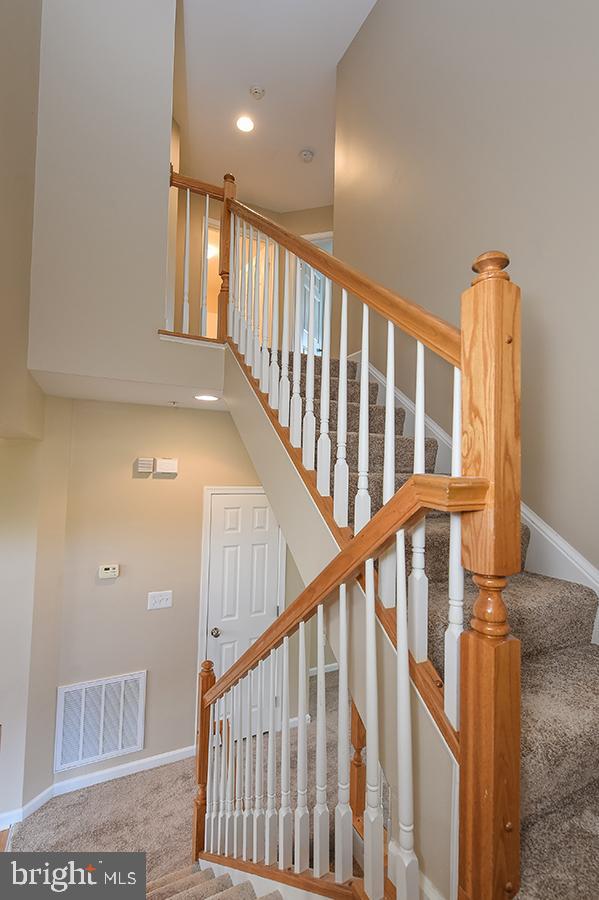 1406 Cat Tail Court Salisbury, MD 21804 - Photo 31 of 68 a view of staircase with railing and a rug