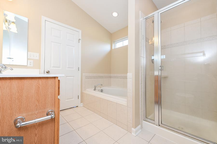 1406 Cat Tail Court Salisbury, MD 21804 - Photo 38 of 68 a bathroom with a bathtub and a shower