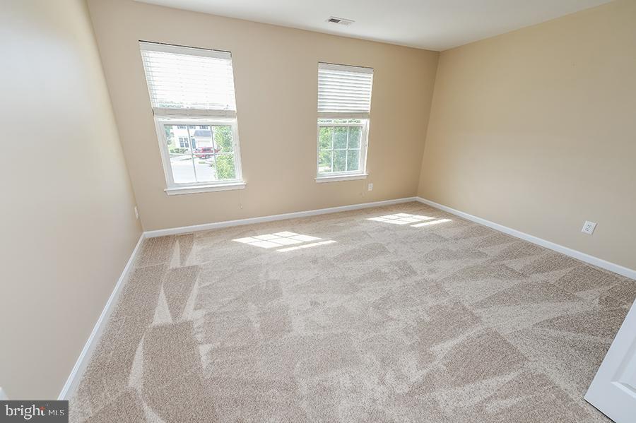 1406 Cat Tail Court Salisbury, MD 21804 - Photo 46 of 68 an empty room with windows