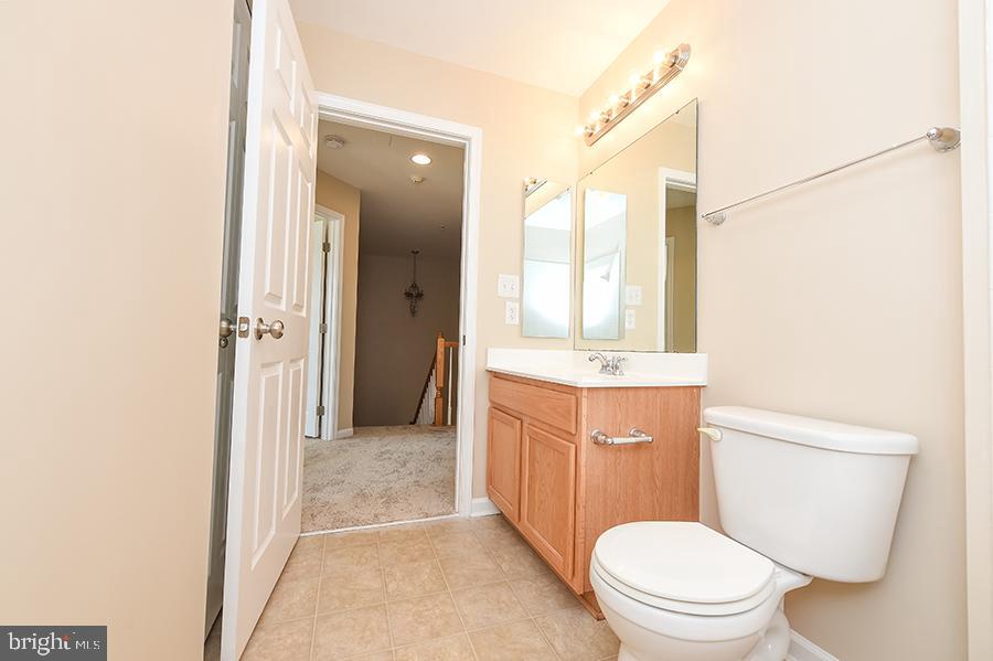1406 Cat Tail Court Salisbury, MD 21804 - Photo 50 of 68 a bathroom with a granite countertop sink toilet and shower