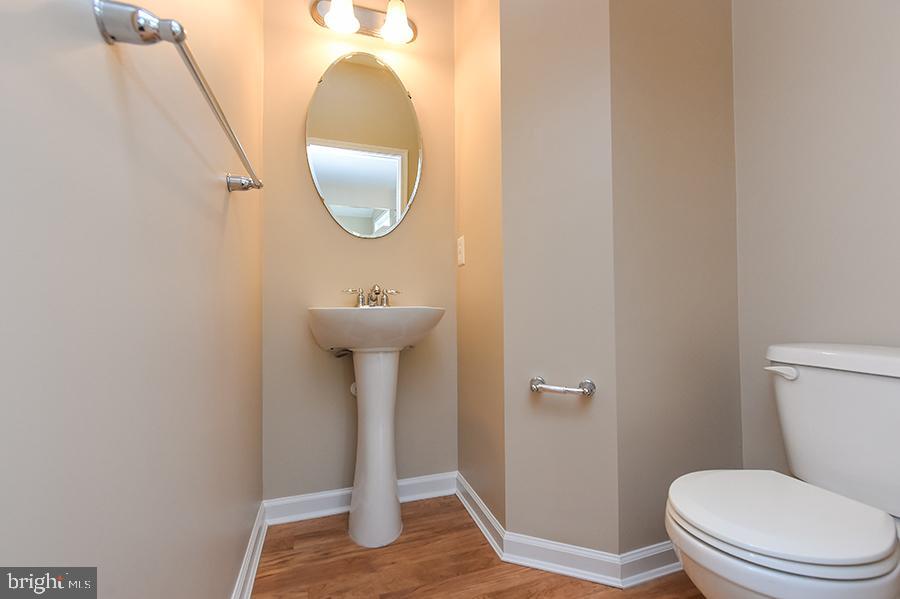 1406 Cat Tail Court Salisbury, MD 21804 - Photo 54 of 68 a bathroom with a toilet and a mirror