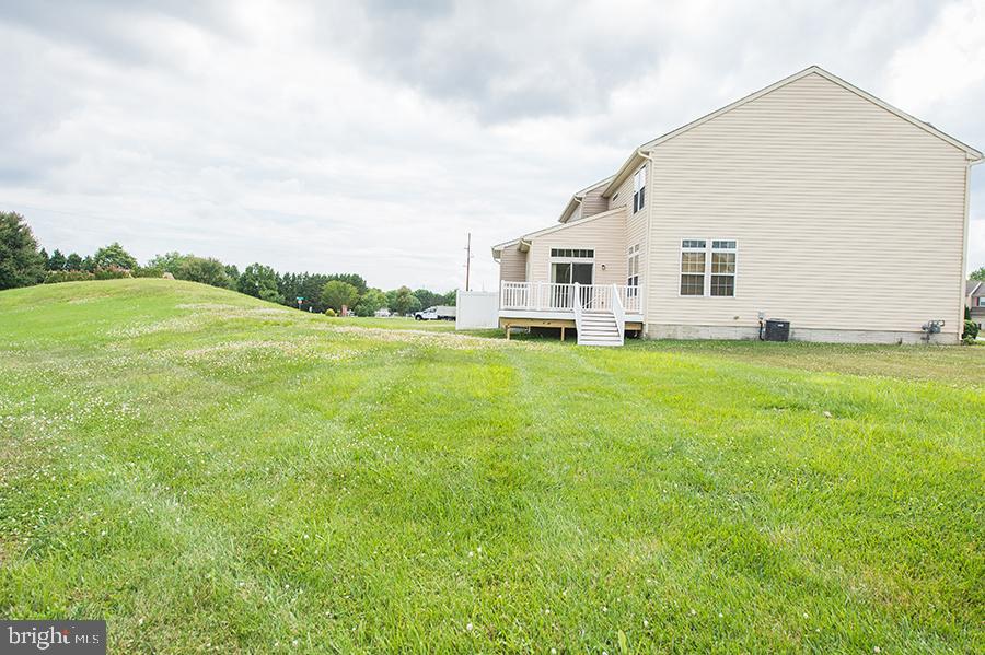 1406 Cat Tail Court Salisbury, MD 21804 - Photo 65 of 68 a view of a house with a big yard and large trees