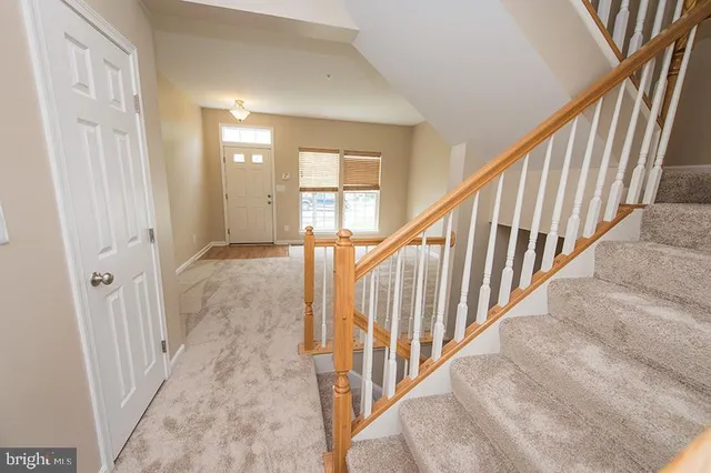 a view of a kitchen with a sink microwave and cabinets