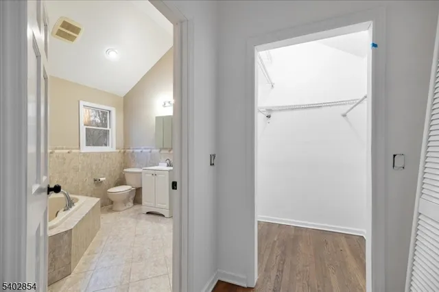 a bathroom with a toilet sink and shower