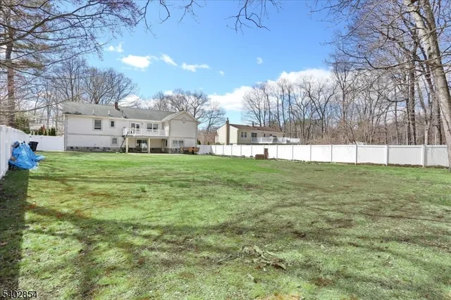 a view of a house with a big yard