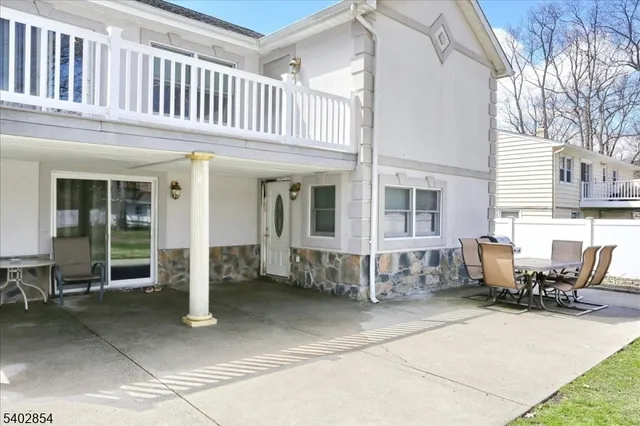 a view of a house with outdoor seating