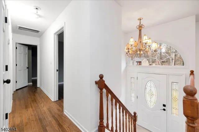 a view of entryway with wooden floor