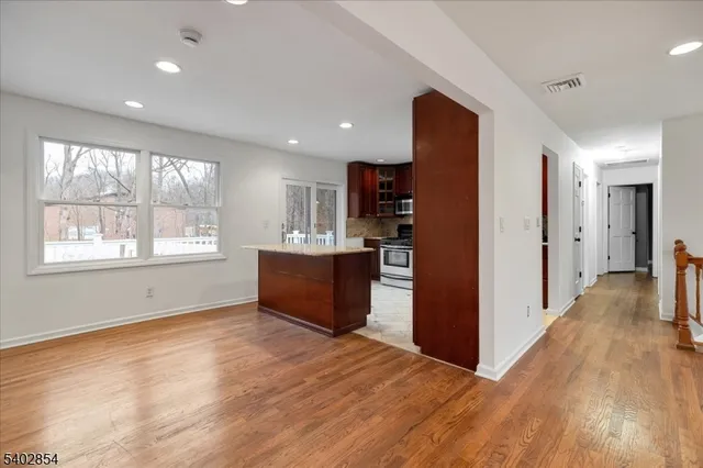 a view of kitchen with window and wooden floor