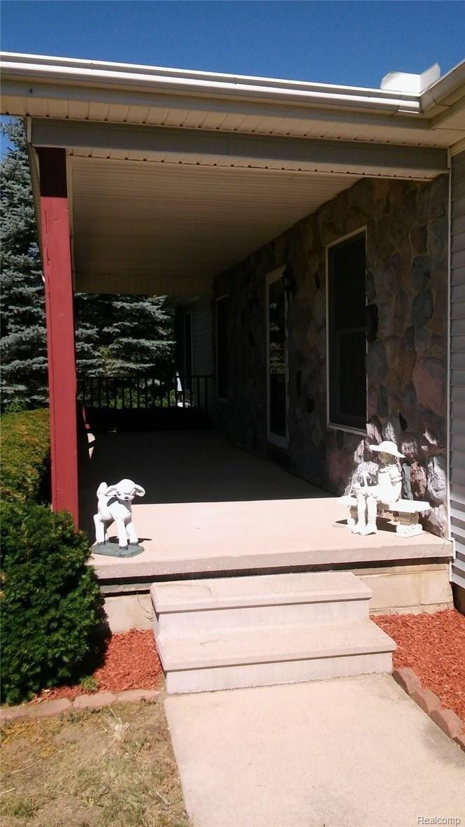 19028 Williamsville Road Gregory, MI 48137 - Photo 4 of 37 front porch.jpg