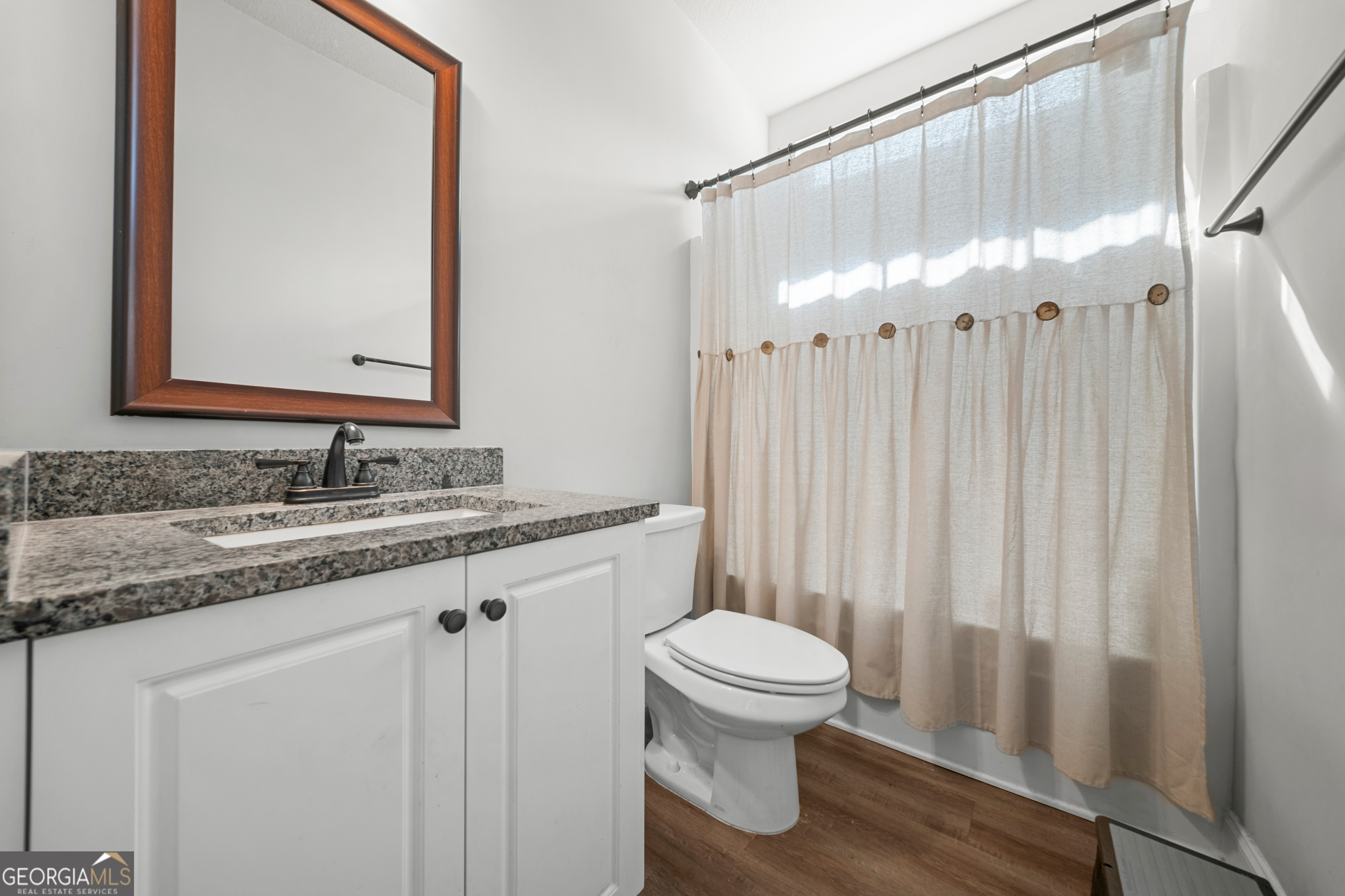 401 Elwick Place Statesboro, GA 30461 - Photo 13 of 36 a bathroom with a granite countertop sink toilet and shower