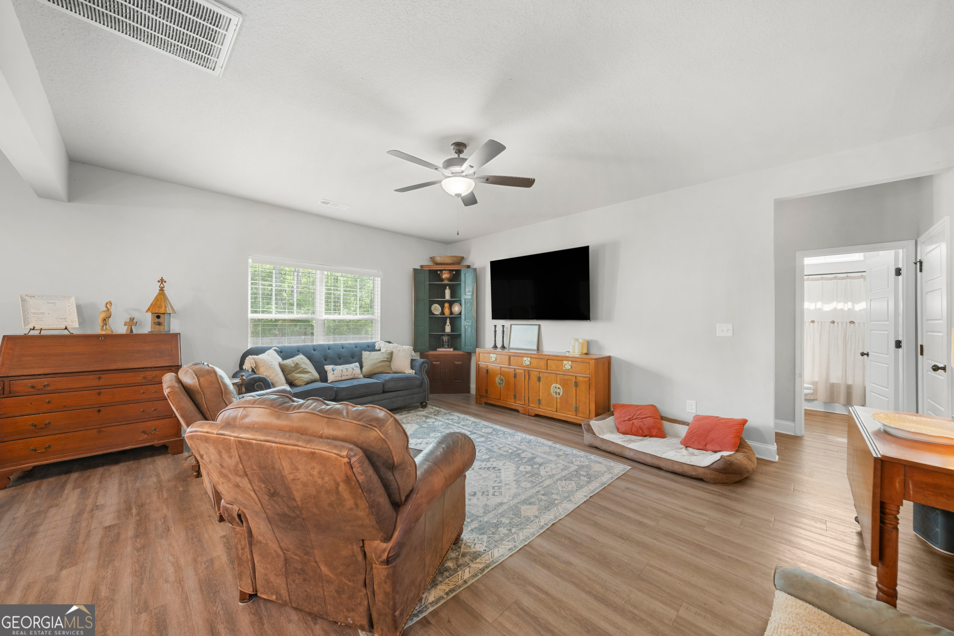 401 Elwick Place Statesboro, GA 30461 - Photo 14 of 36 a bedroom with furniture and a flat screen tv