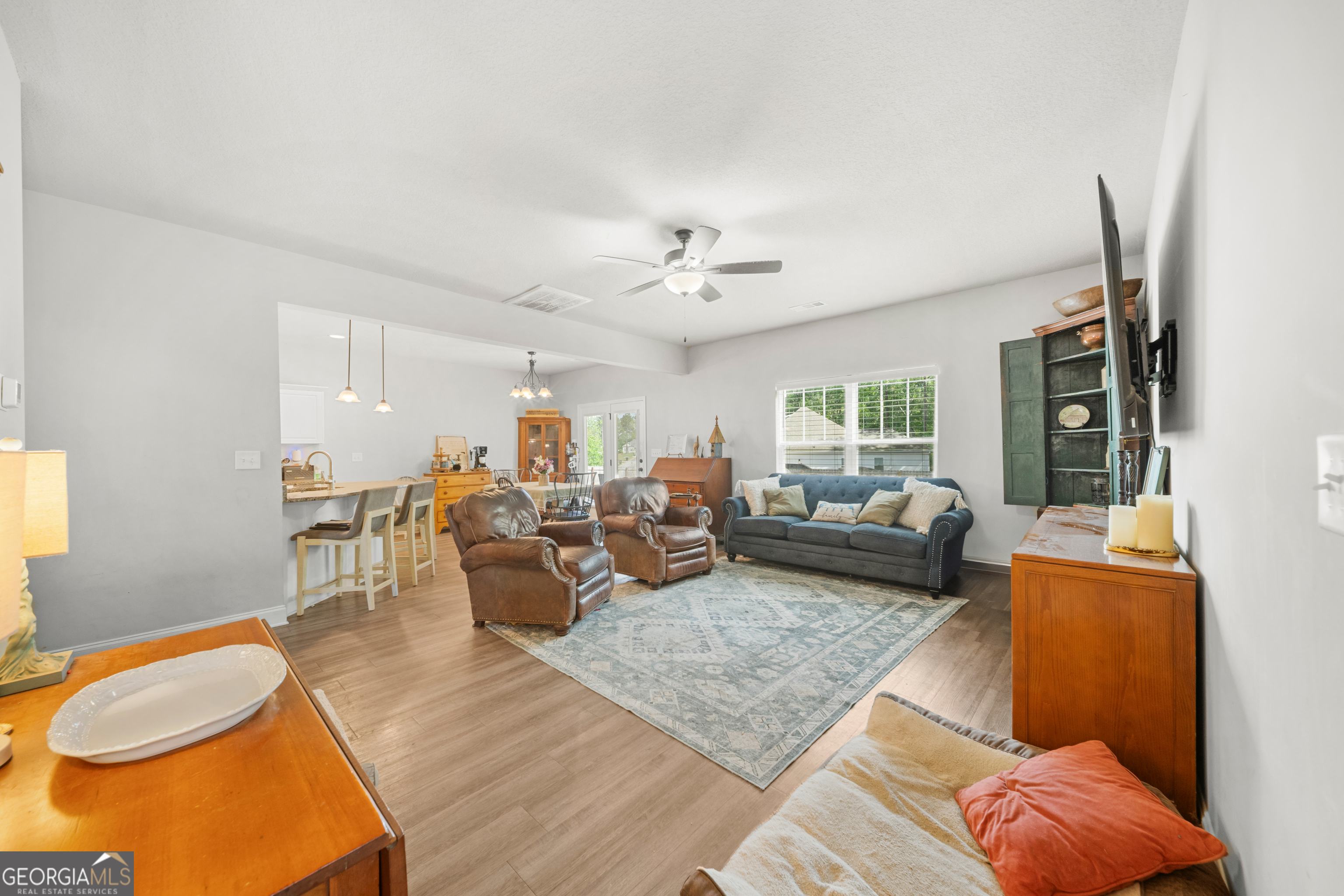 401 Elwick Place Statesboro, GA 30461 - Photo 15 of 36 a living room with furniture and a chandelier