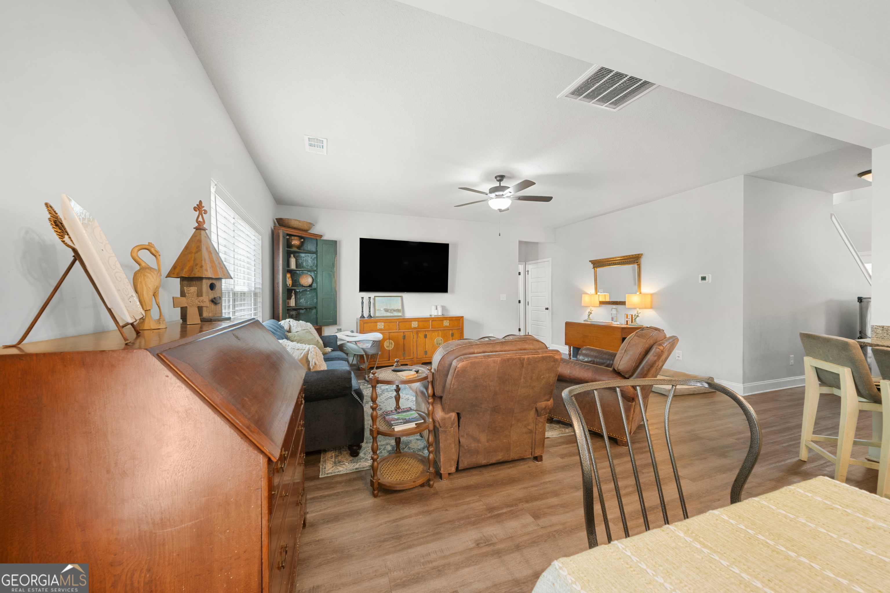 401 Elwick Place Statesboro, GA 30461 - Photo 16 of 36 a living room with furniture and a flat screen tv