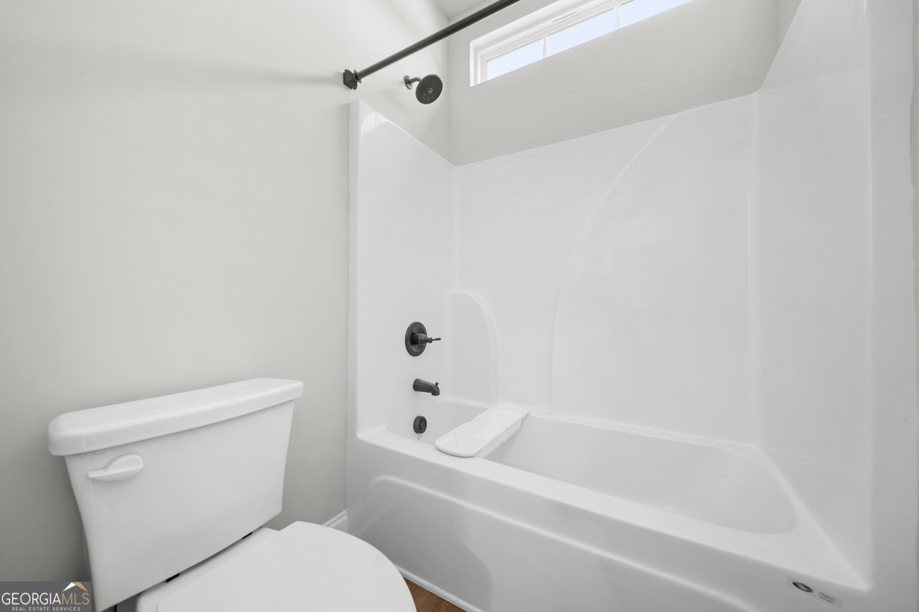 401 Elwick Place Statesboro, GA 30461 - Photo 17 of 36 a white toilet sitting next to a bath tub