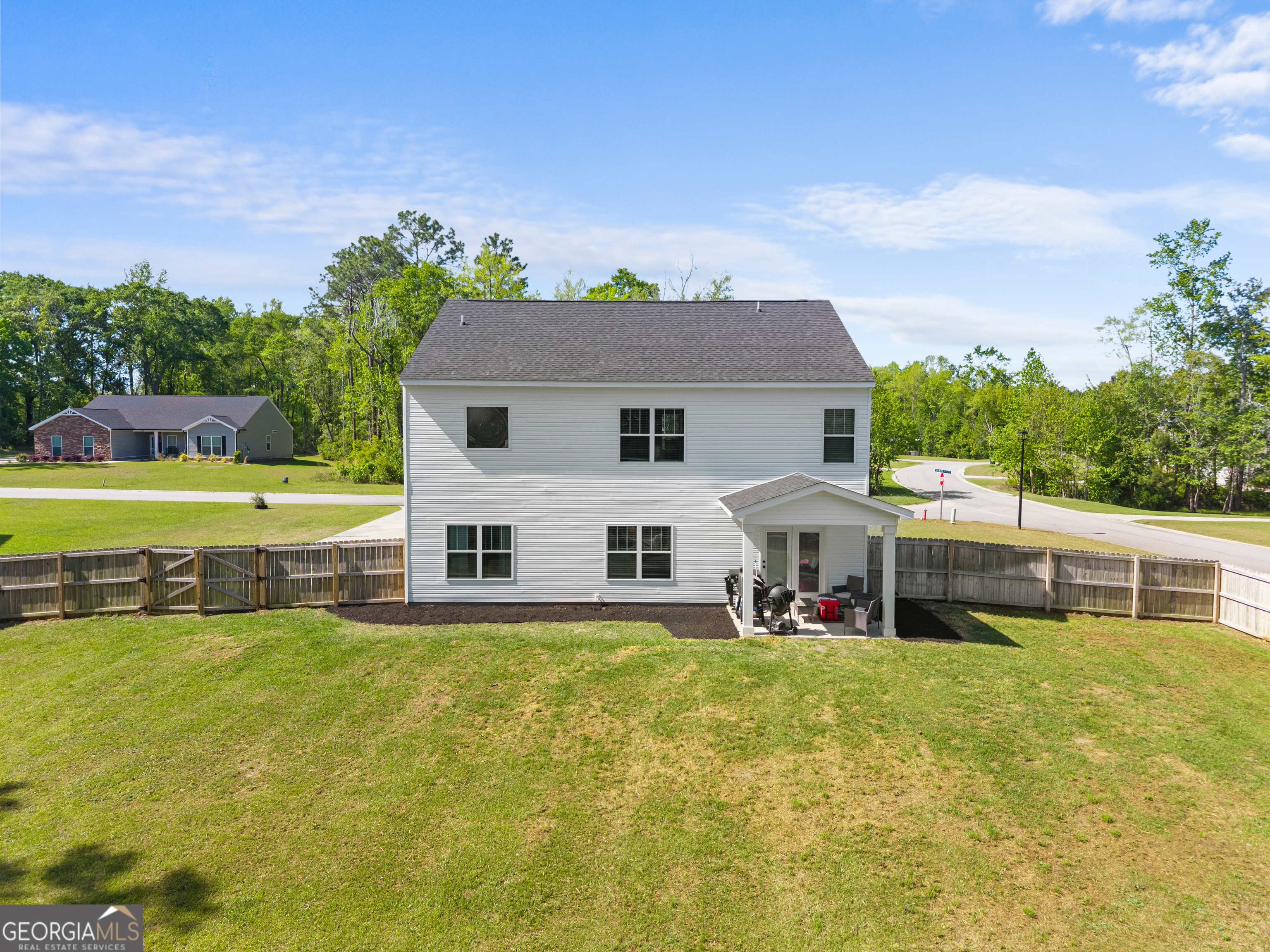 401 Elwick Place Statesboro, GA 30461 - Photo 27 of 36 a view of a house with a big yard and potted plants