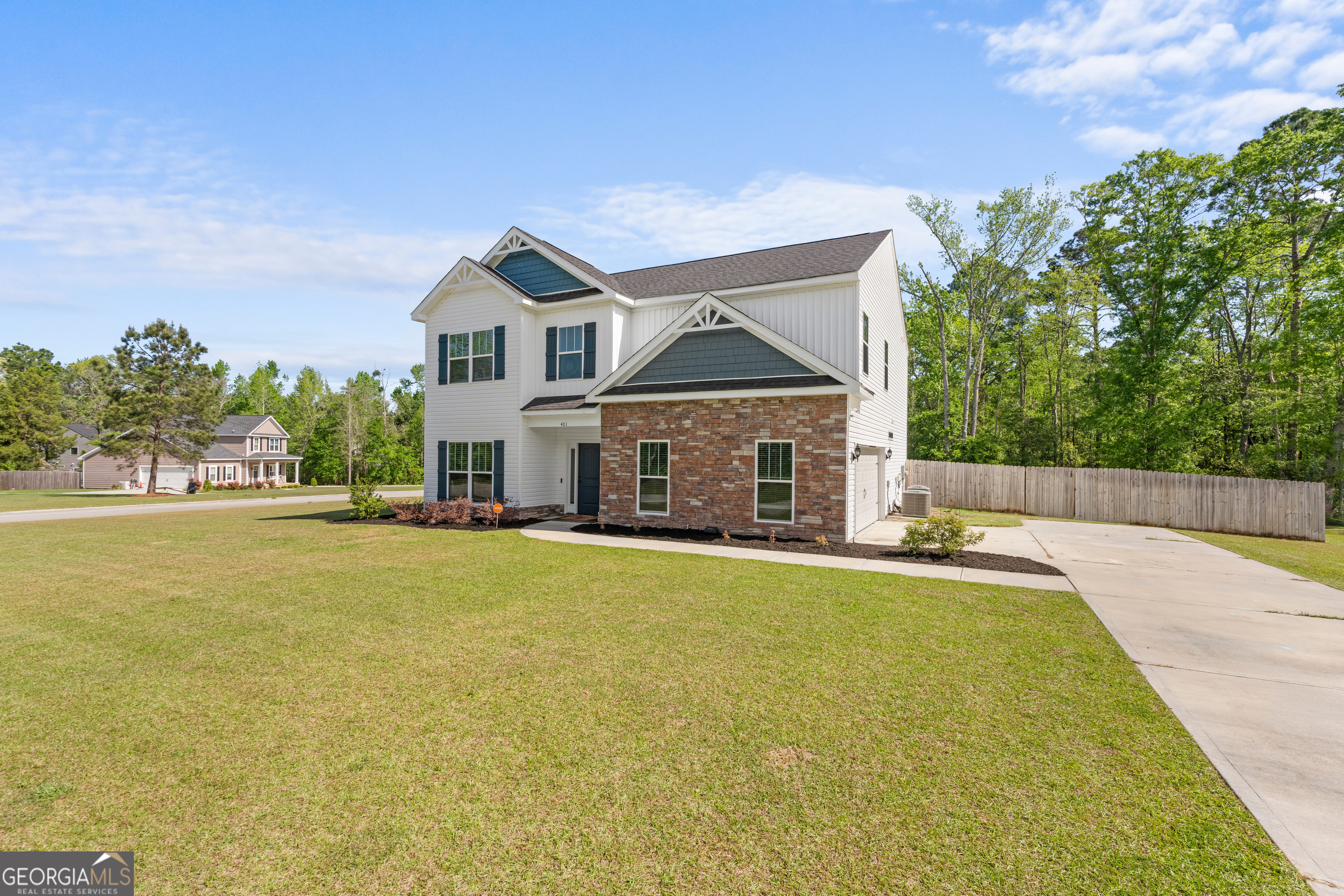 401 Elwick Place Statesboro, GA 30461 - Photo 3 of 36 a front view of house with yard and trees in the background