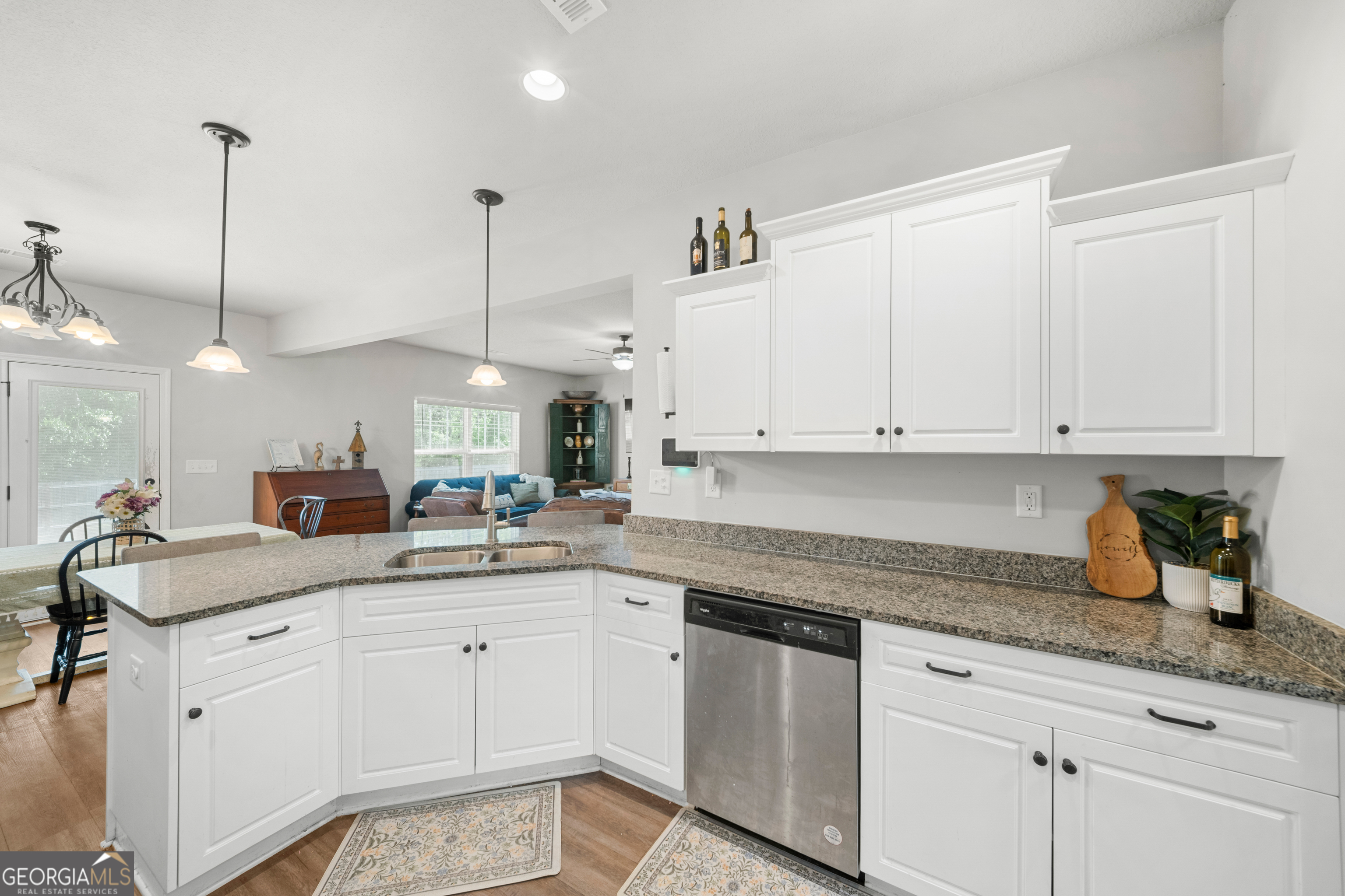 401 Elwick Place Statesboro, GA 30461 - Photo 8 of 36 a kitchen with white cabinets sink and white appliances