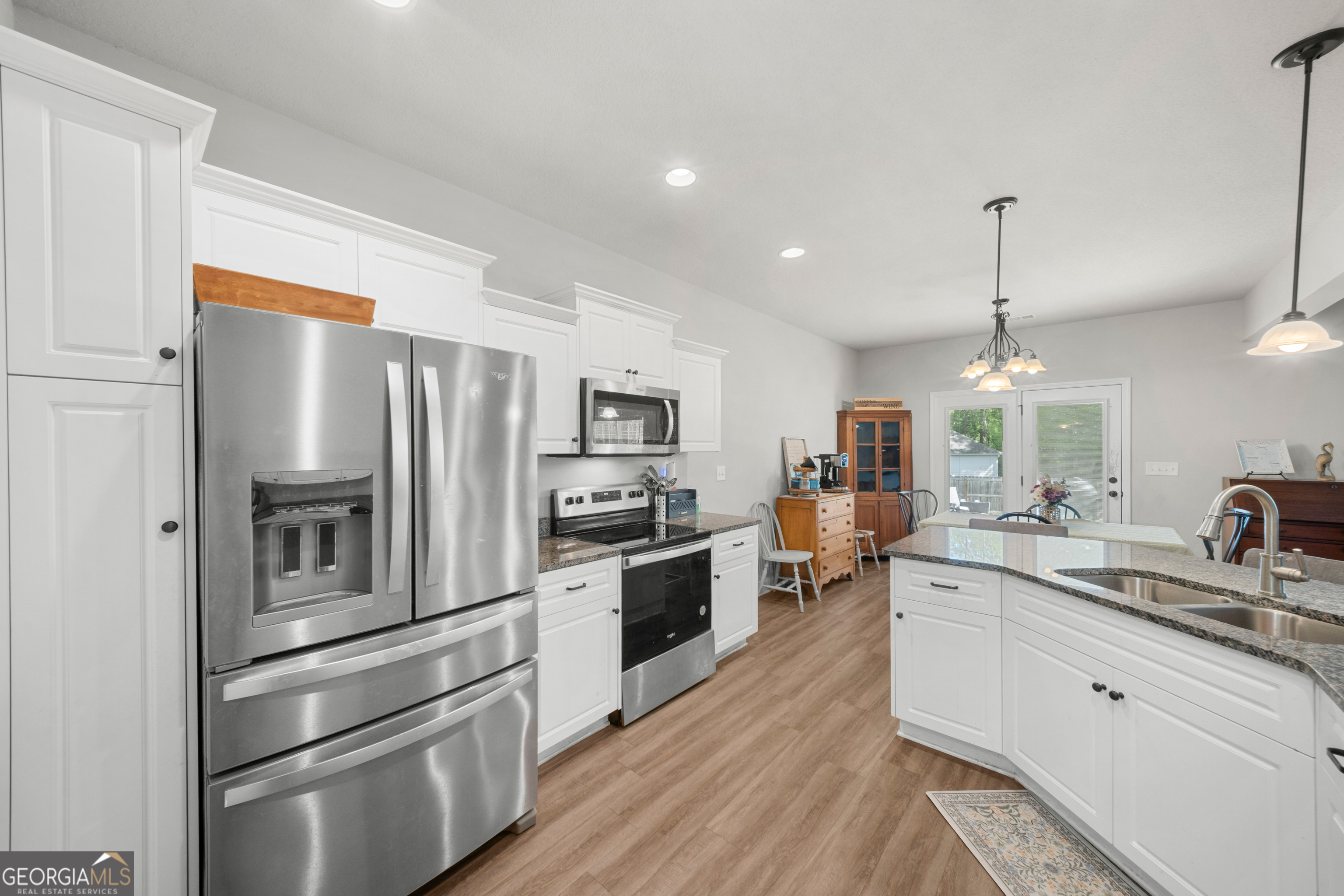 401 Elwick Place Statesboro, GA 30461 - Photo 9 of 36 a kitchen with stainless steel appliances a refrigerator sink and cabinets