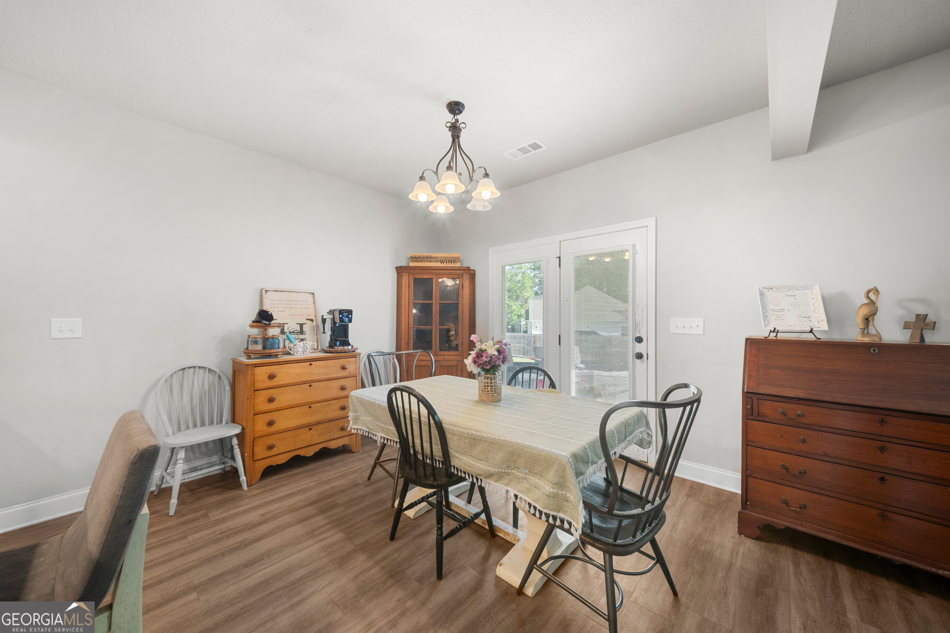 401 Elwick Place Statesboro, GA 30461 - Photo 10 of 36 a view of a dining room with furniture and wooden floor